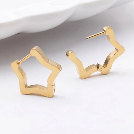 ORRÉ Star Huggie Earrings in gold — product detail photograph