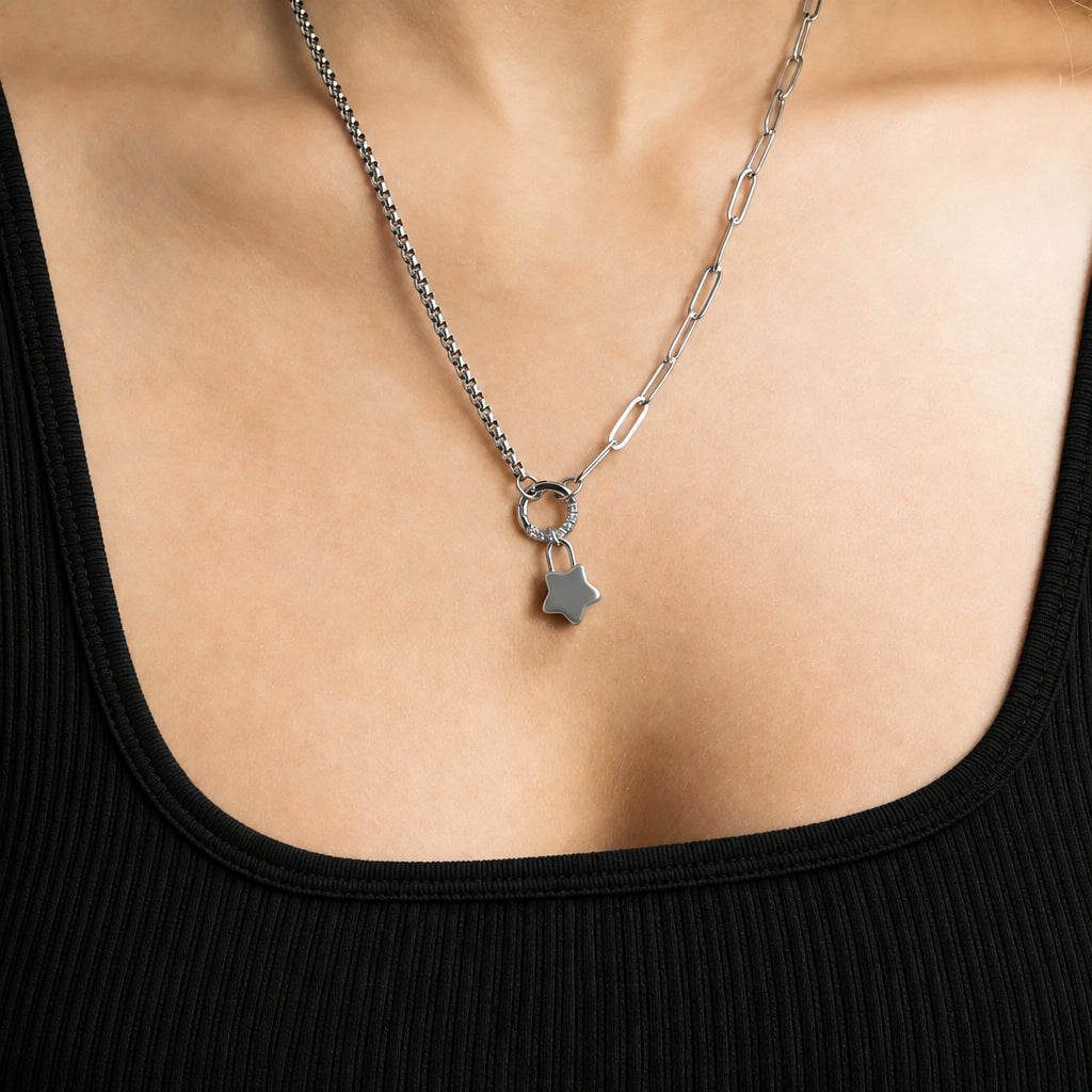 ORRÉ Star Lock Charm in silver — styled jewelry photograph