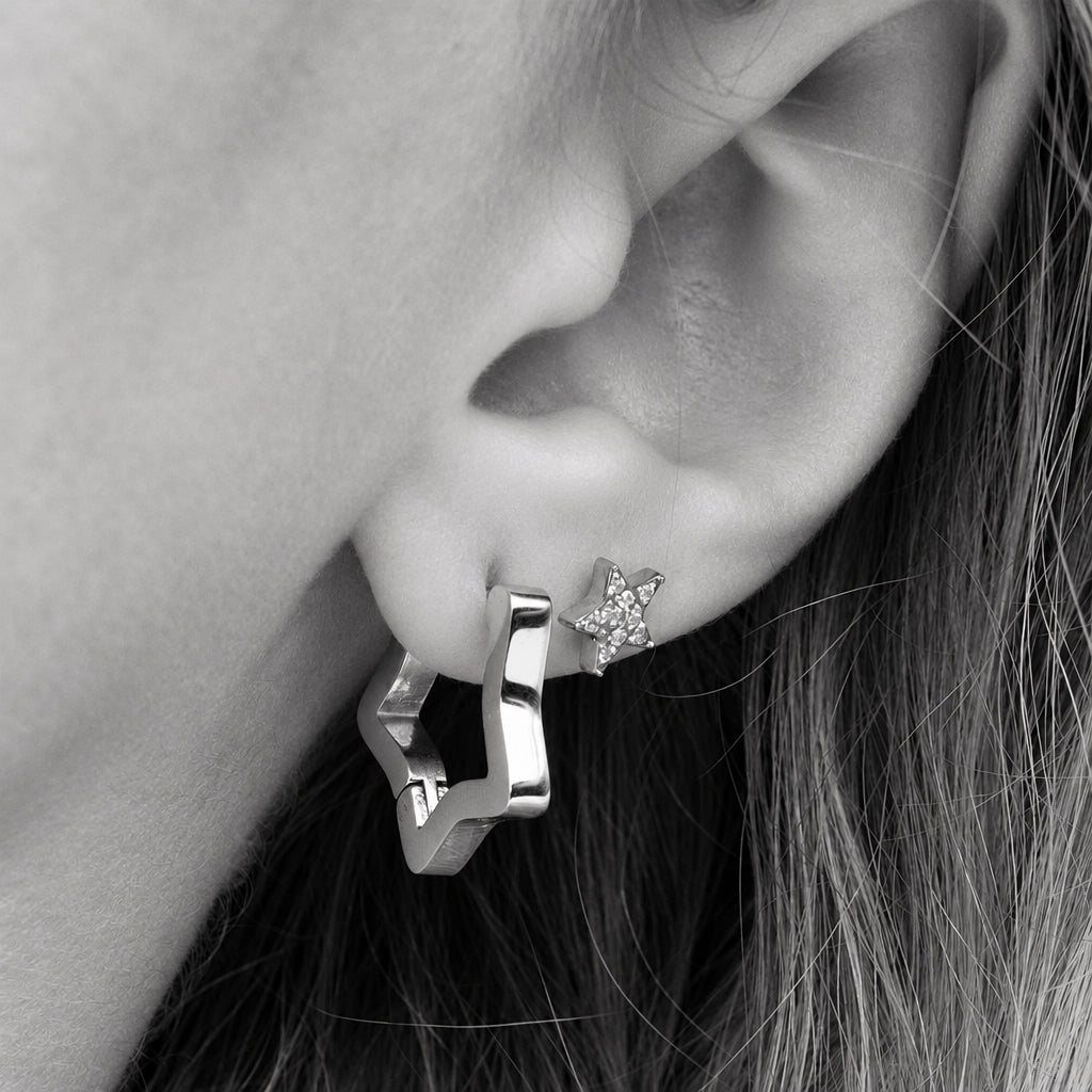 ORRÉ Star Huggie Earrings in silver — styled jewelry photograph