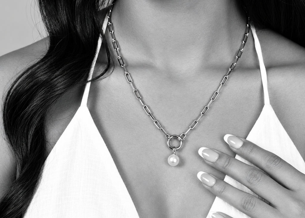 ORRÉ Carabiner Charm Holder Necklace in gold — styled jewelry photograph